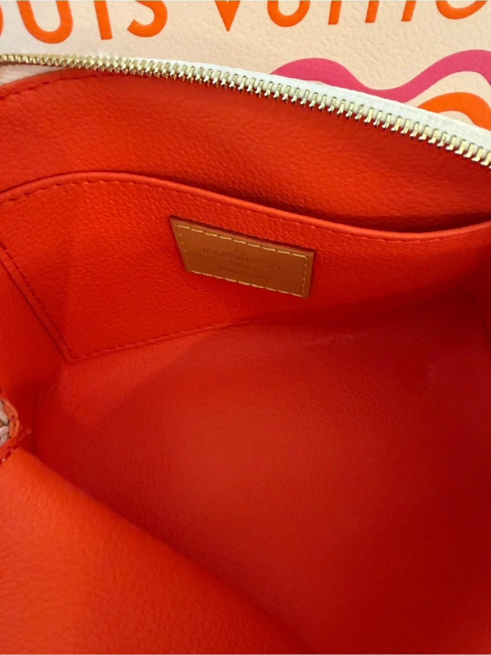 Louis Vuitton Cream Cosmetic Pouch with Pink & Orange Monogram.